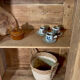 Antique glass-fronted terracotta cupboard