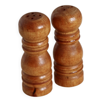 Vintage wooden salt and pepper shakers in the shape of mills