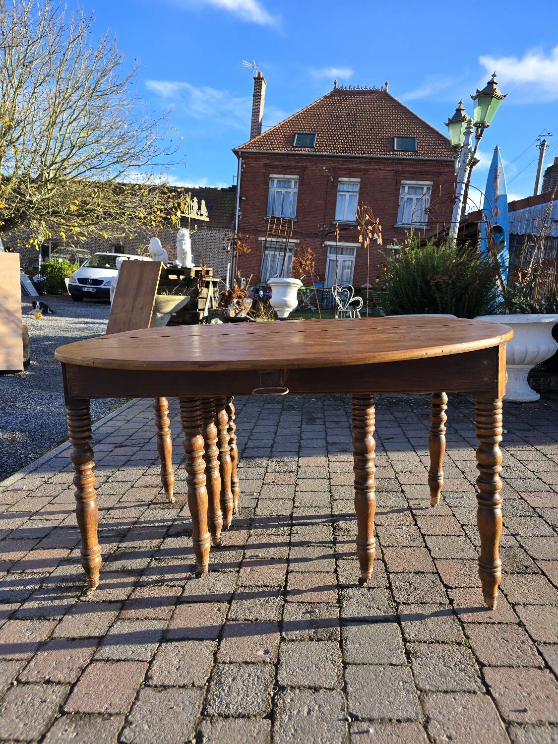 12-foot round oak table with 7 extensions / 20 people