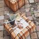 Pair of vintage 70s fabric coffee tables with glass tops