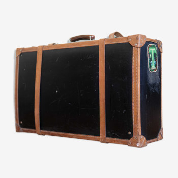 Leather suitcase with sticker