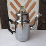 Silver metal coffee maker with glass cap