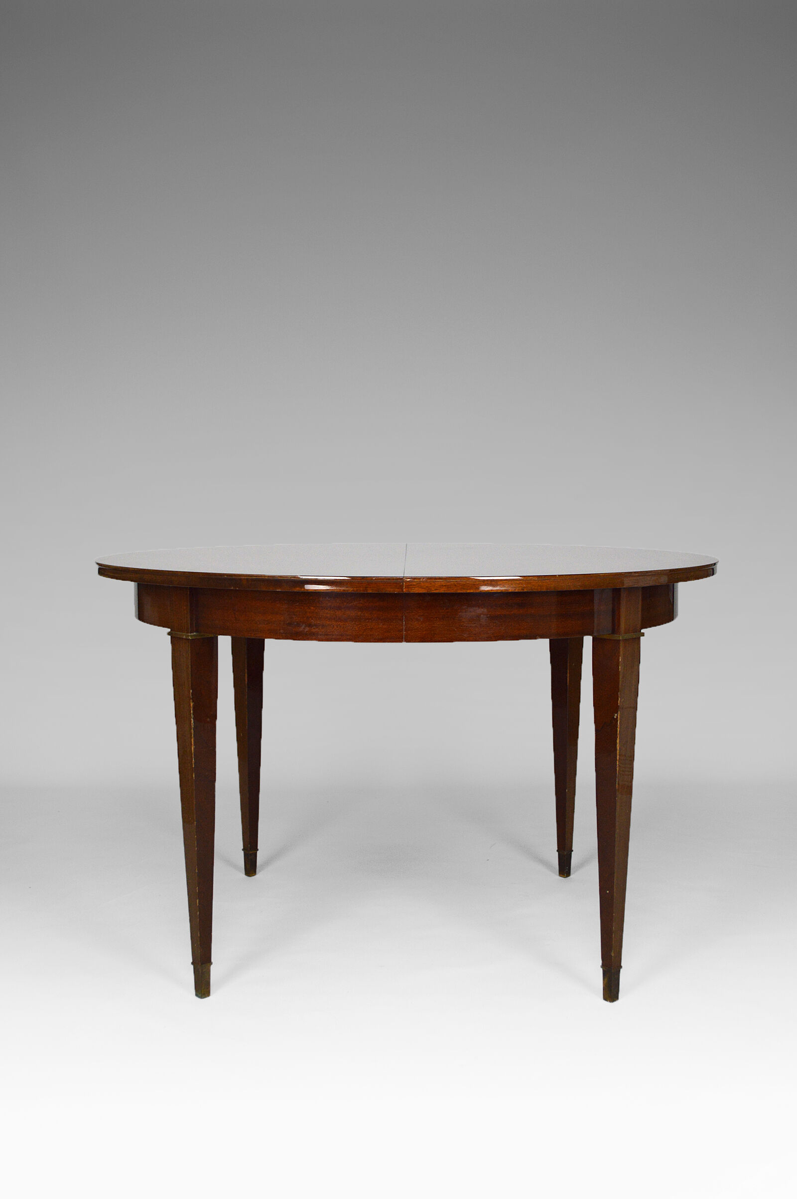 Art Deco mahogany round table by Jacques Adnet around 1940