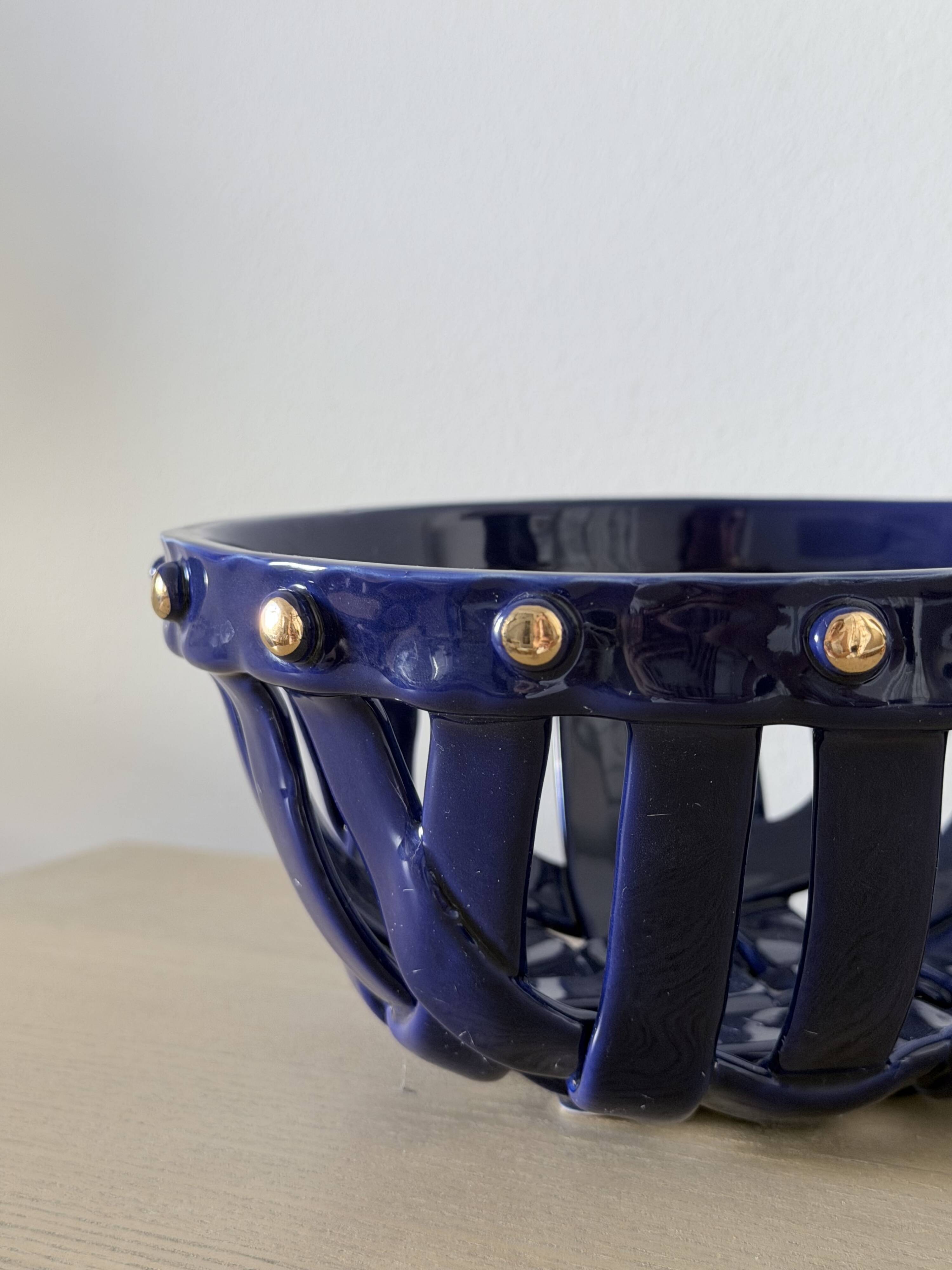 Large cobalt blue openwork bowl with golden studs