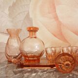 Pink glass liquor service and its accessories from the 1950s