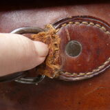 Old monogrammed leather travel suitcase and barony crown