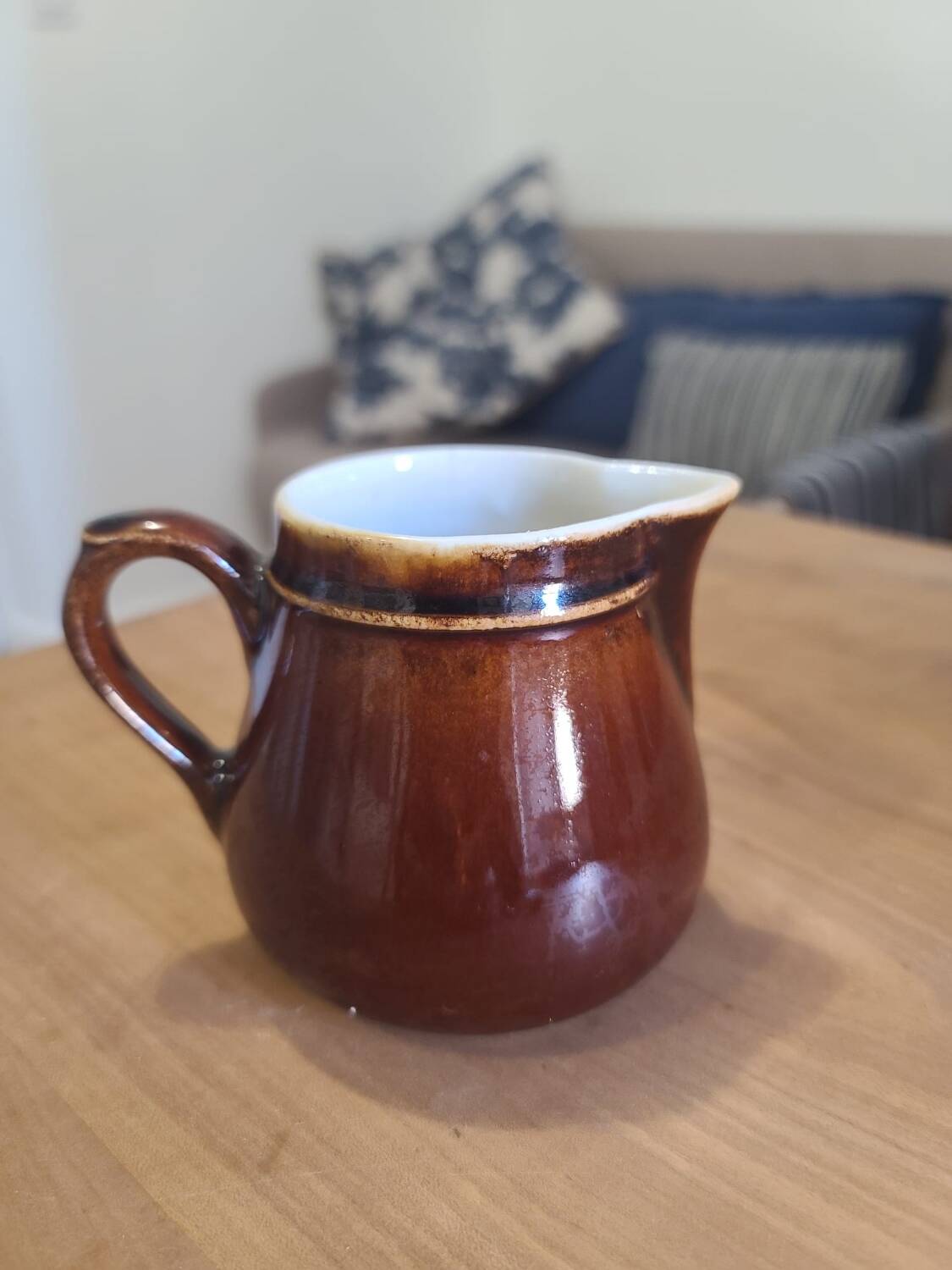Brown ceramic milk jug