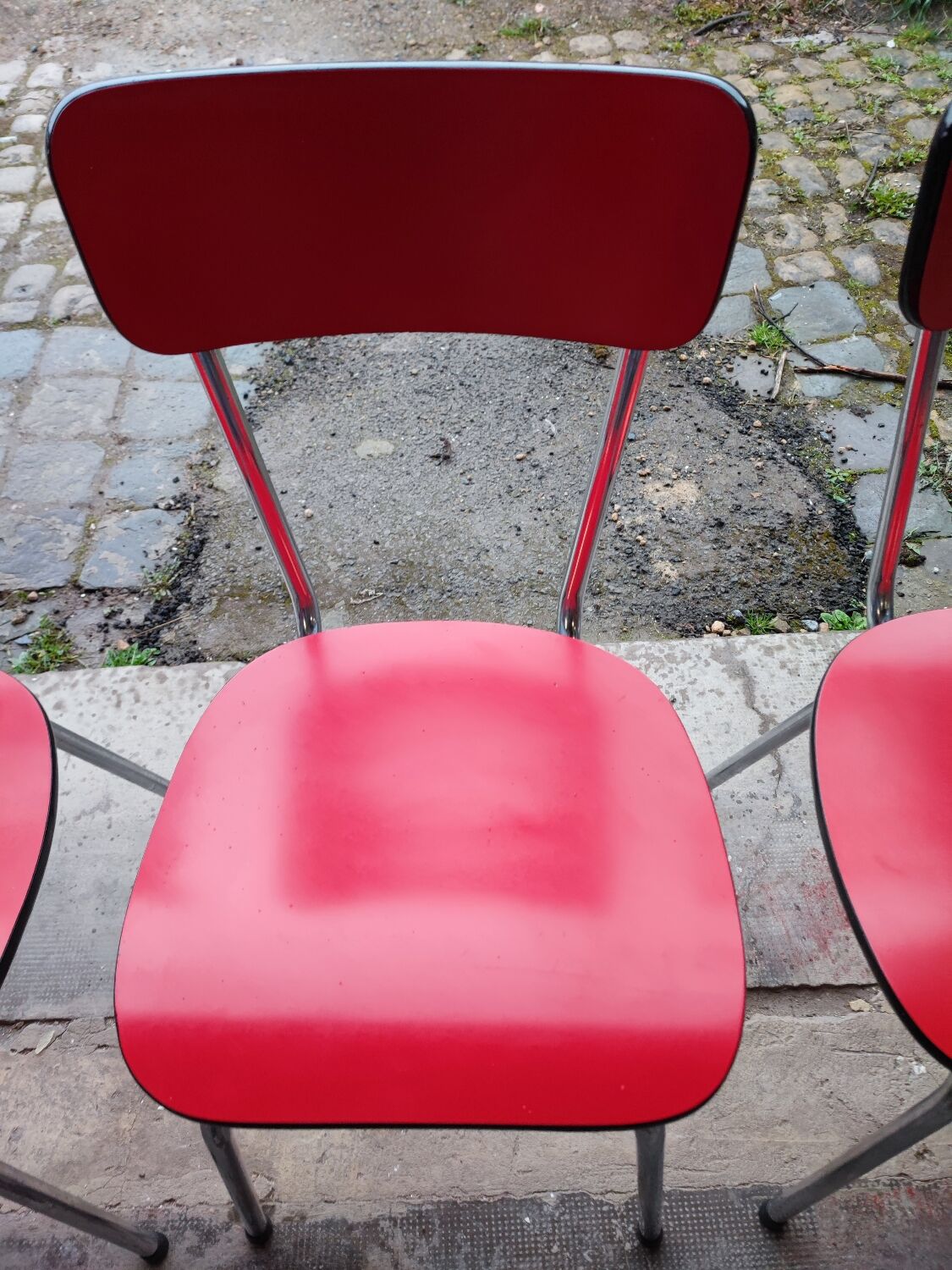 6 red and chrome Formica chairs