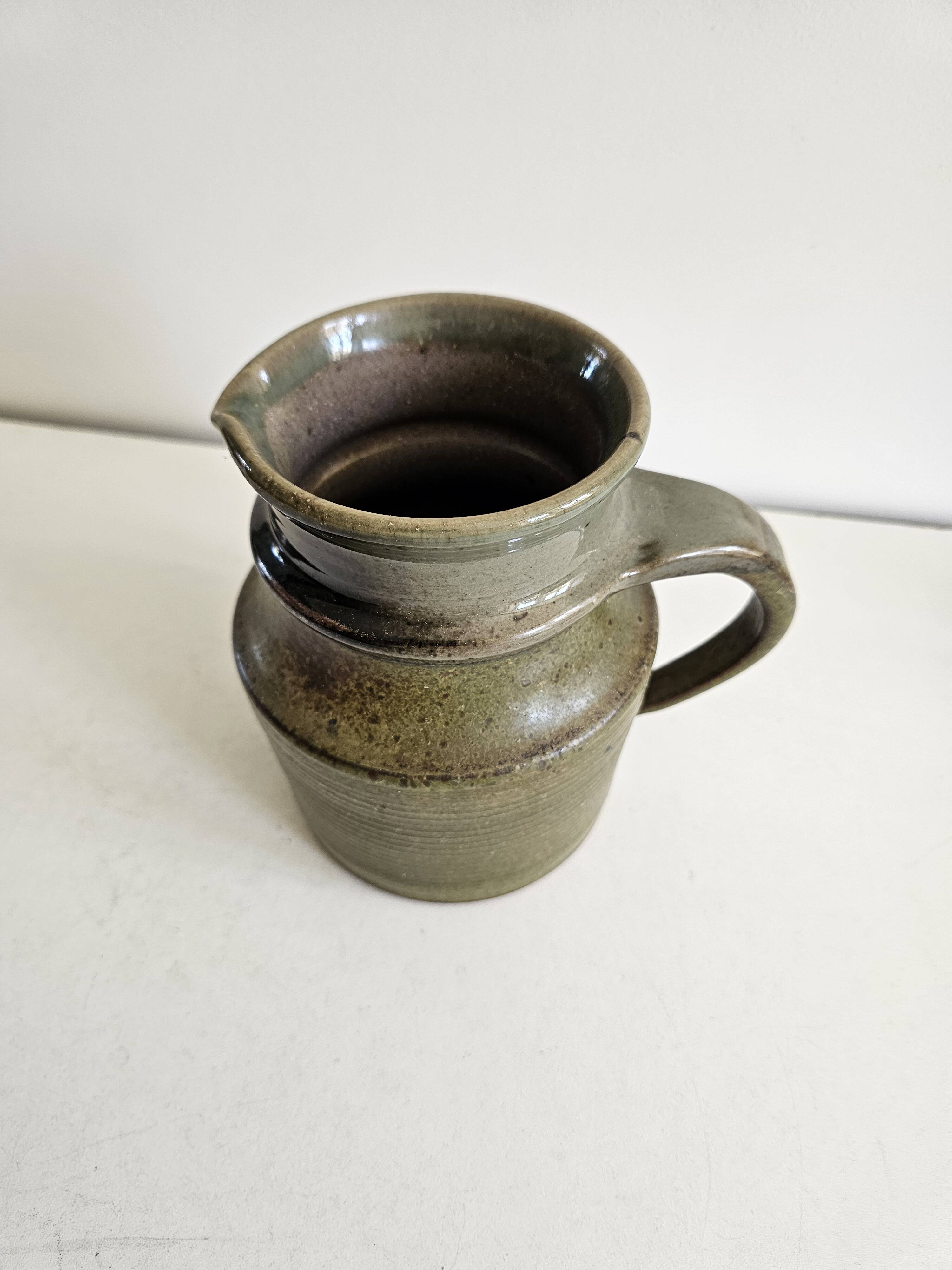 Green glazed ceramic pitcher - Signed Pictogramme
