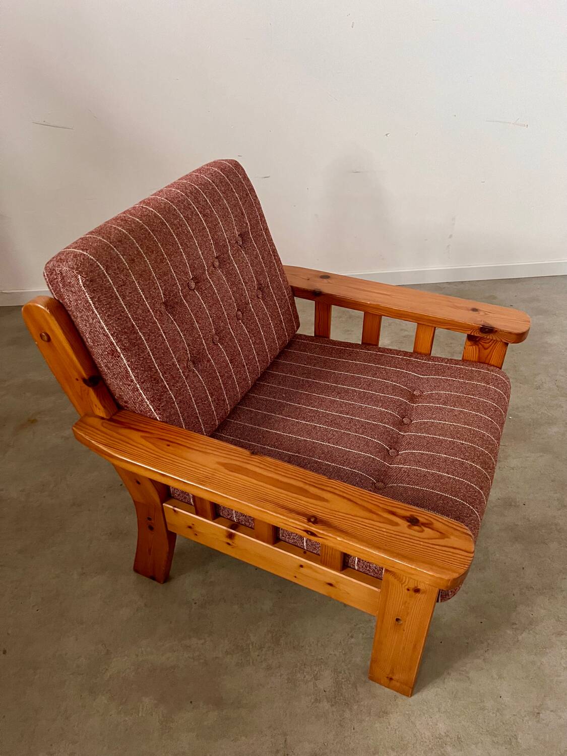 Old vintage Scandinavian design pine armchair from the 70s