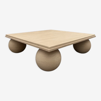 Square stone coffee table with sculptural ball legs