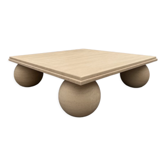 Square stone coffee table with sculptural ball legs