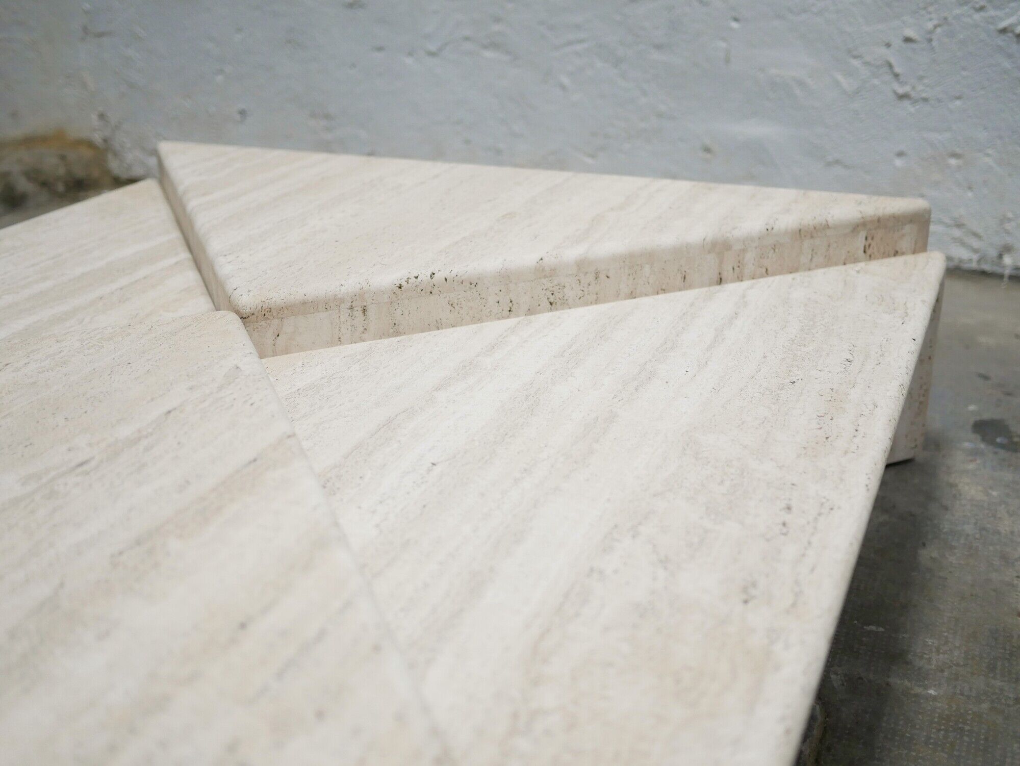 Series of 2 vintage travertine coffee tables published by Roche Bobois