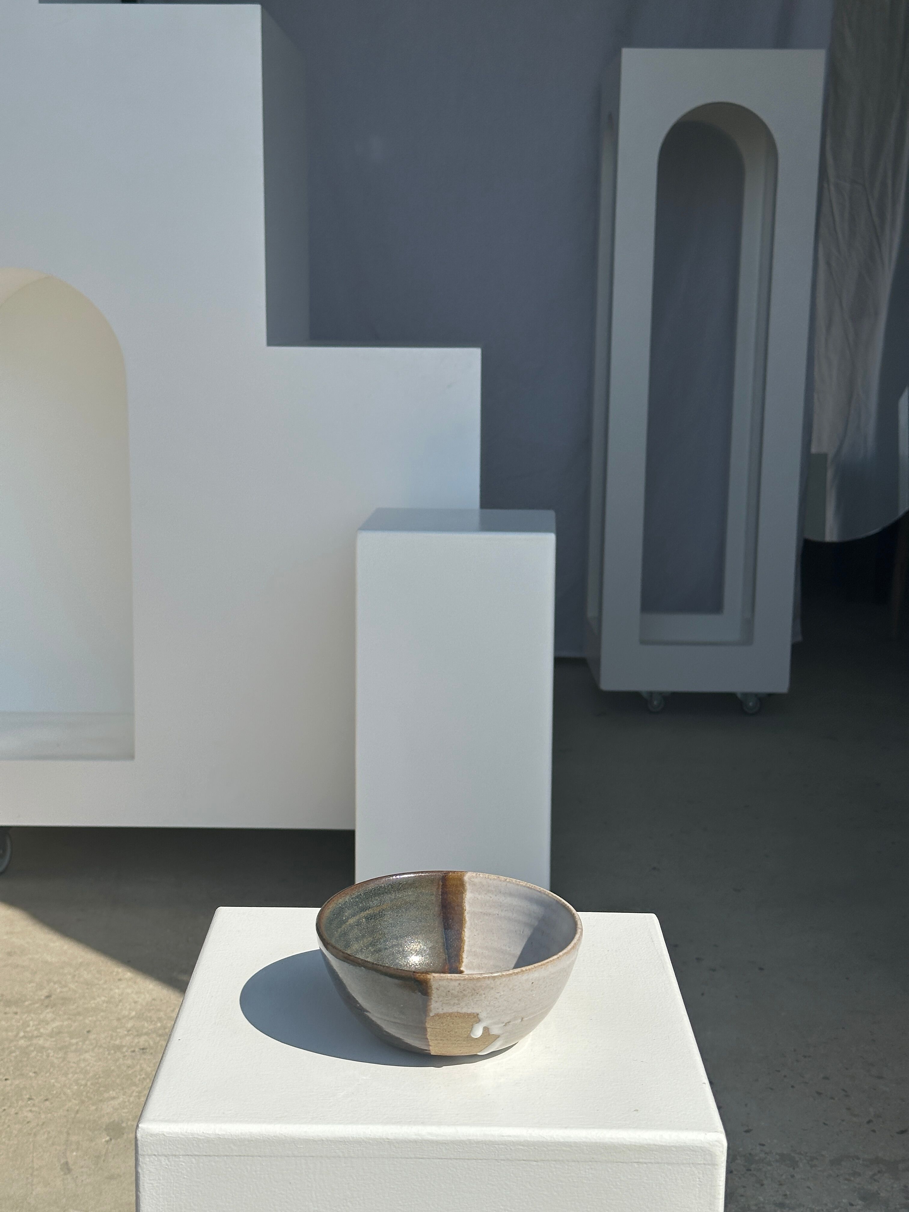 White and glossy brown two-tone ceramic bowl, matt earth