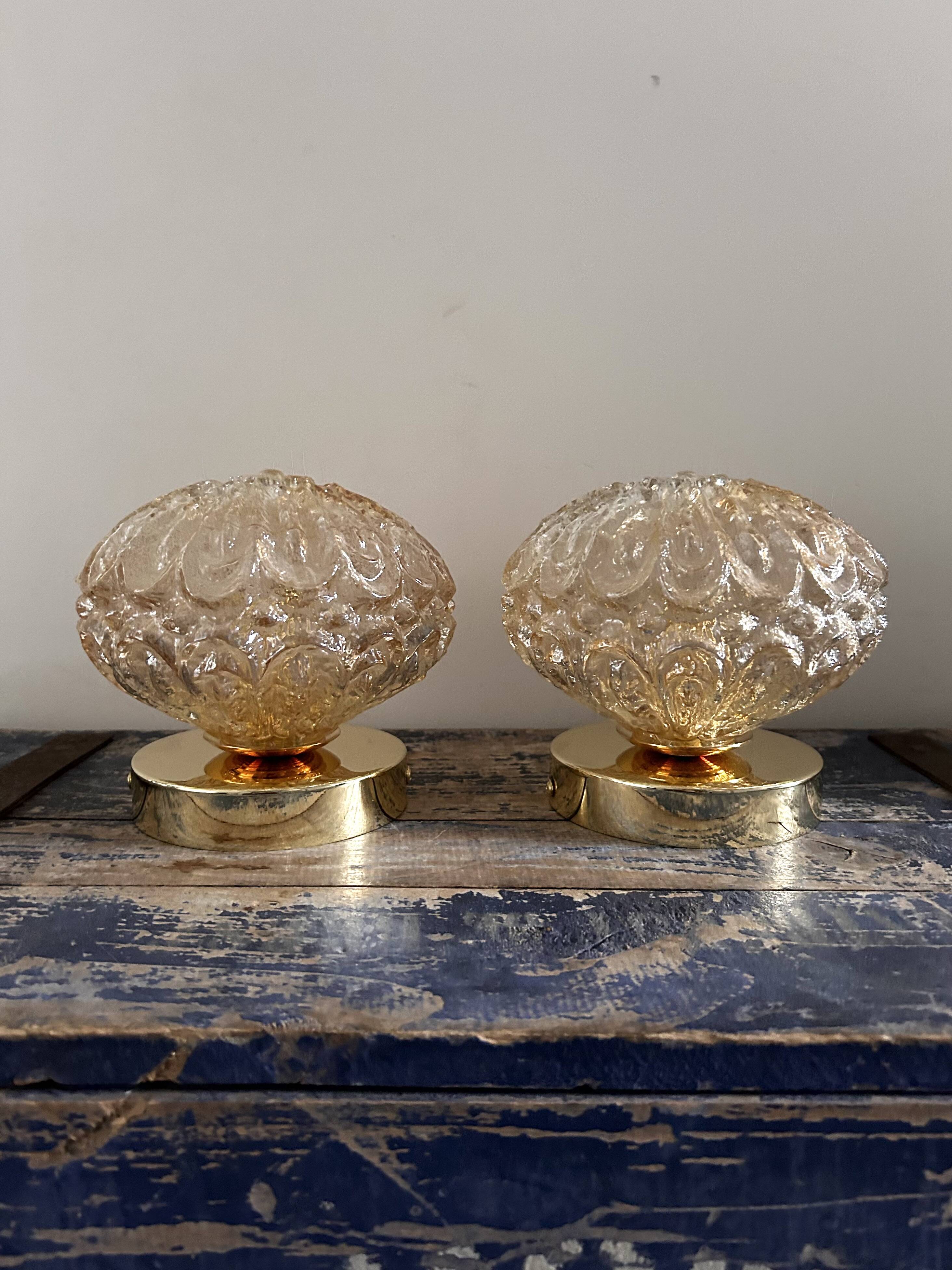 Set of two vintage amber glass wall lights