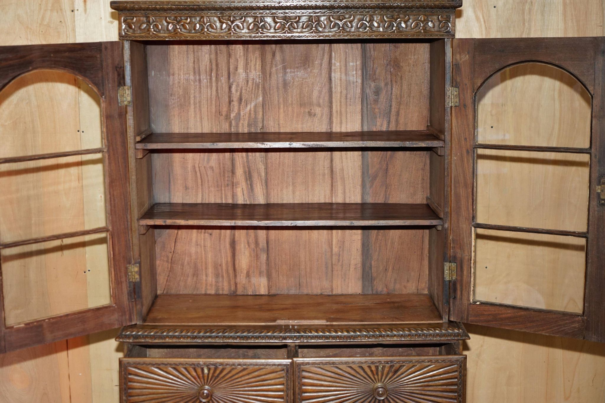 19th-century Anglo-Indian colonial hardwood library on a chest of drawers.