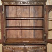 19th-century Anglo-Indian colonial hardwood library on a chest of drawers.