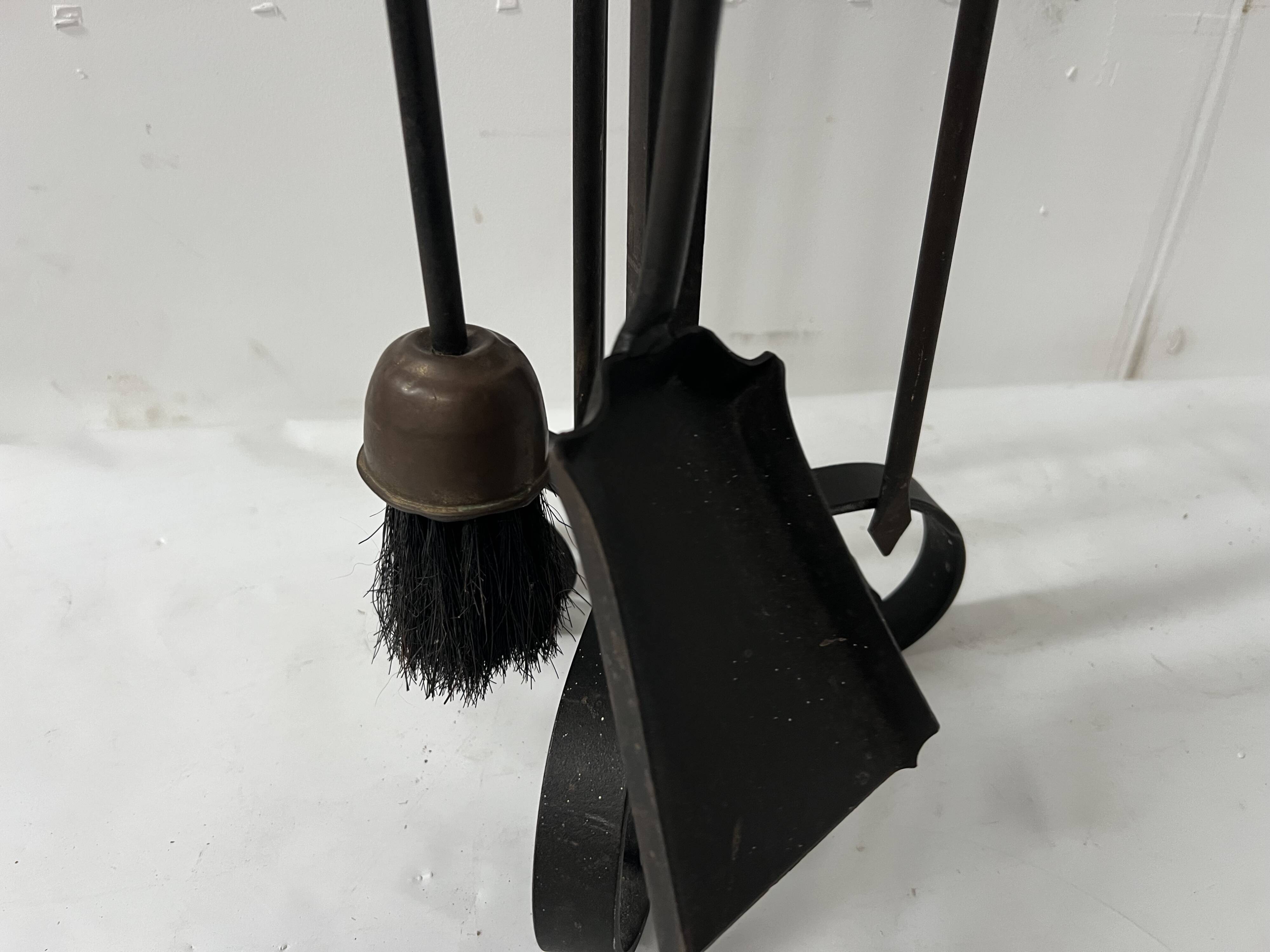 20th century wrought iron and bronze fireplace set