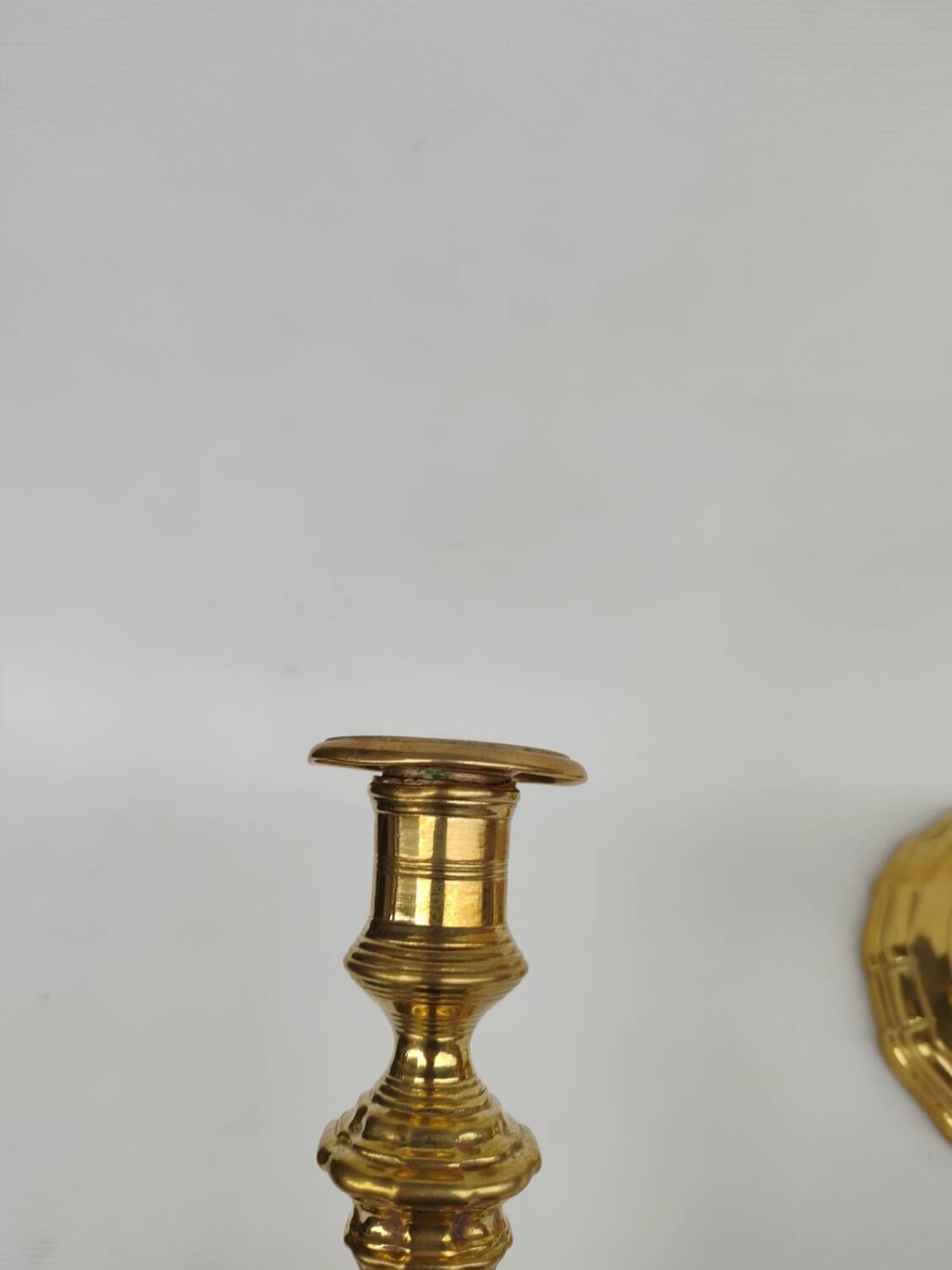 Pair of solid brass candlesticks, early 18th century.