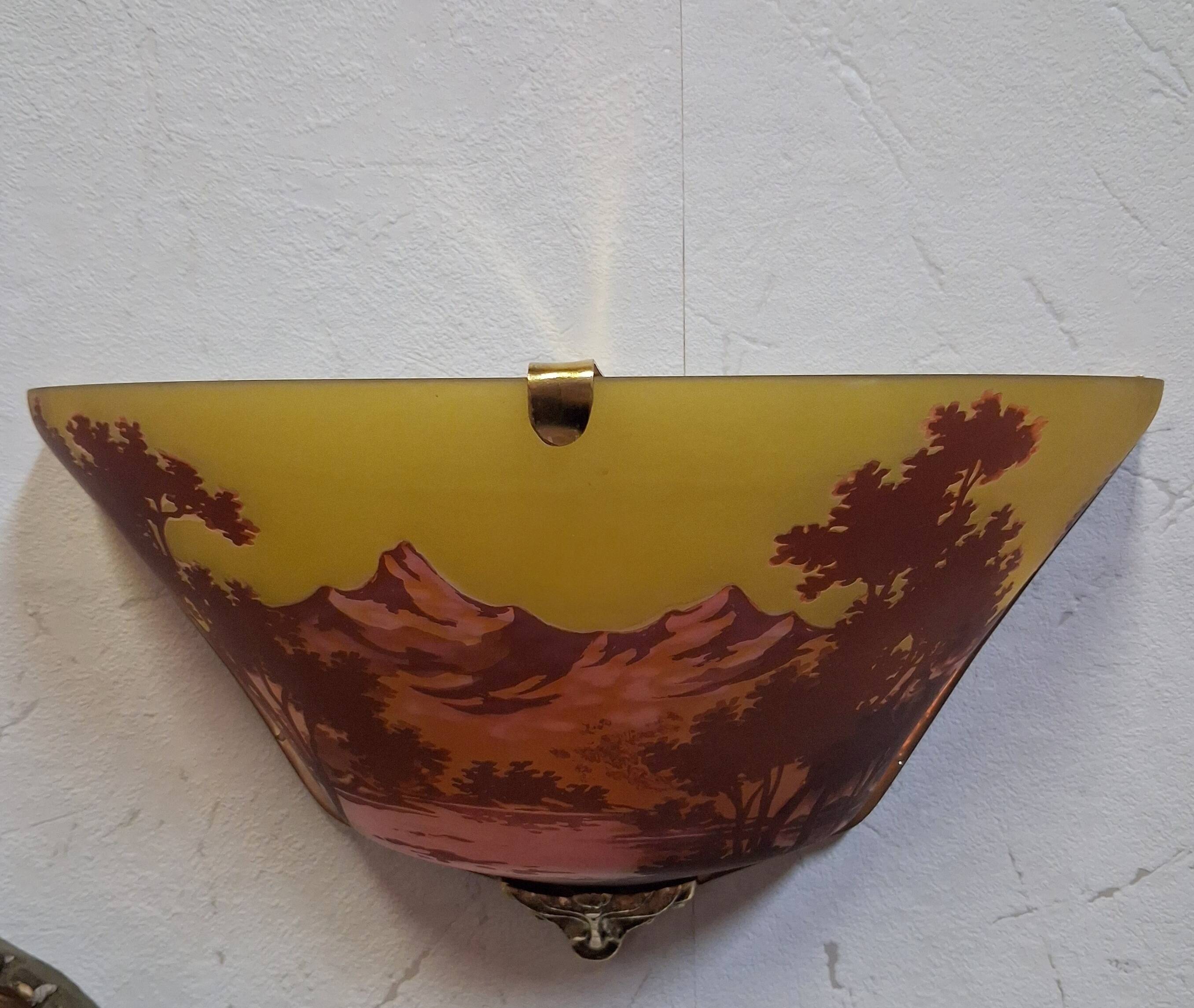Pair of decorative wall sconces in Art Nouveau style.