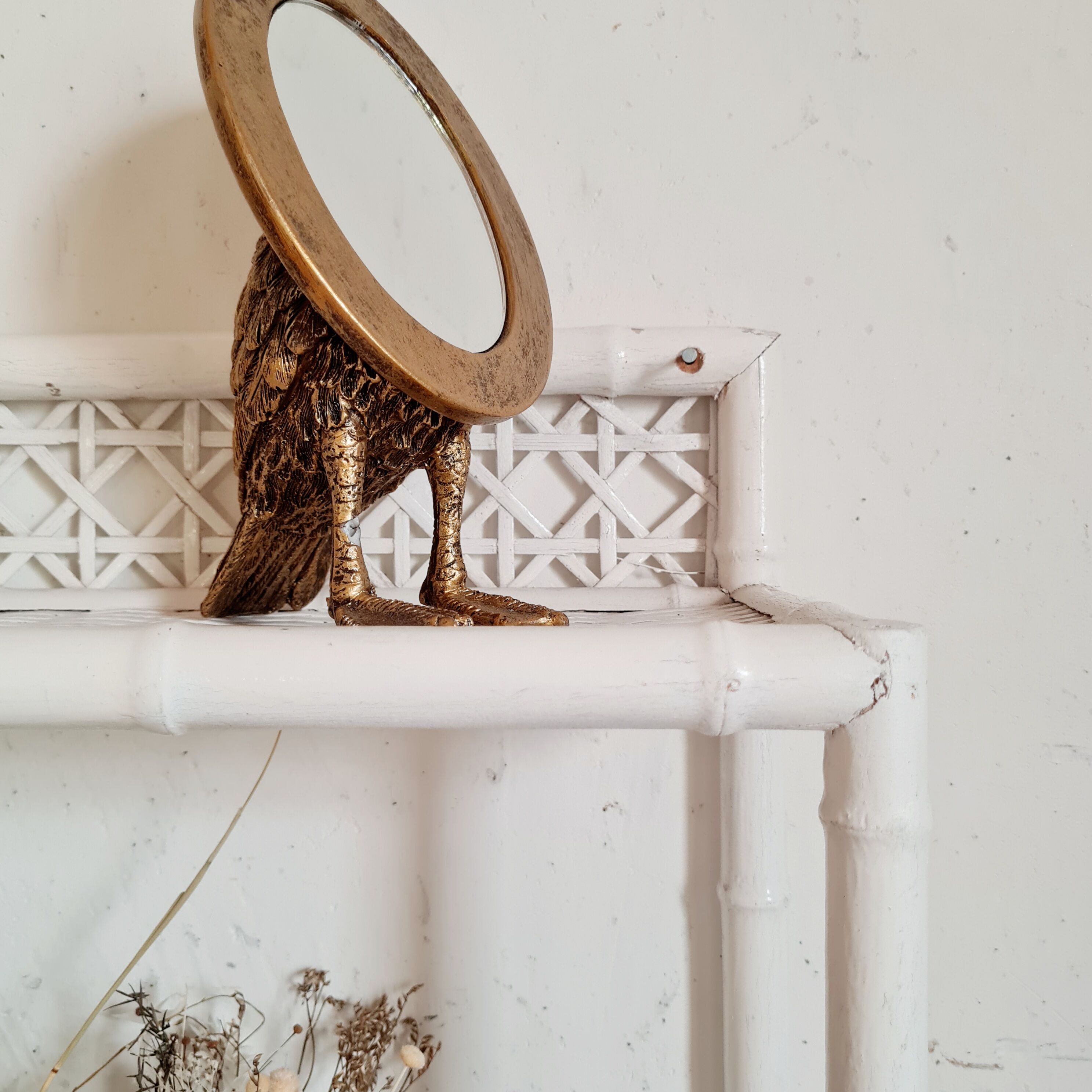 Vintage rattan and bamboo shelves painted white