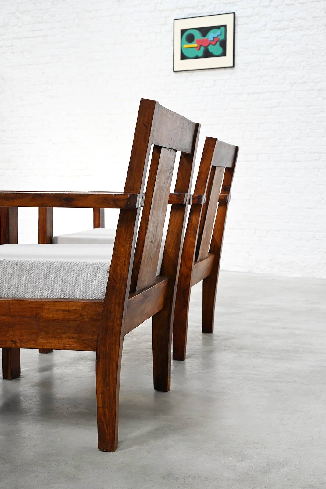 Pair of French modernist teak armchairs, 1960s