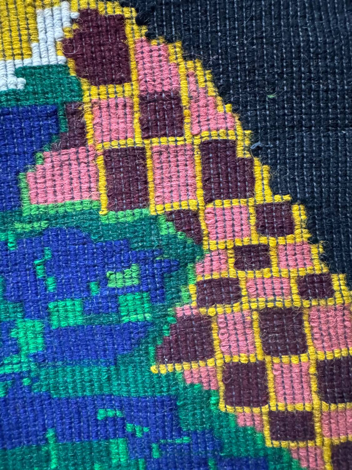 Romanian black wool carpet with a basket of colorful flowers