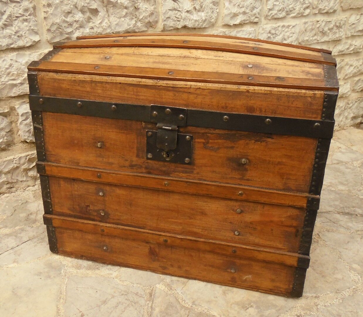 Ancient travel trunk, bulging wooden chest