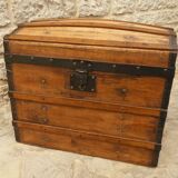 Ancient travel trunk, bulging wooden chest