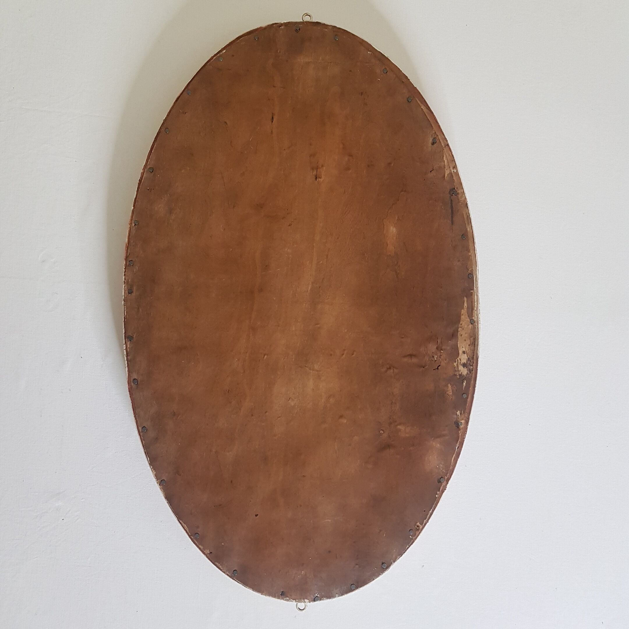 Large oval mirror with bevelled ice in stucque and wood decorated with flowers