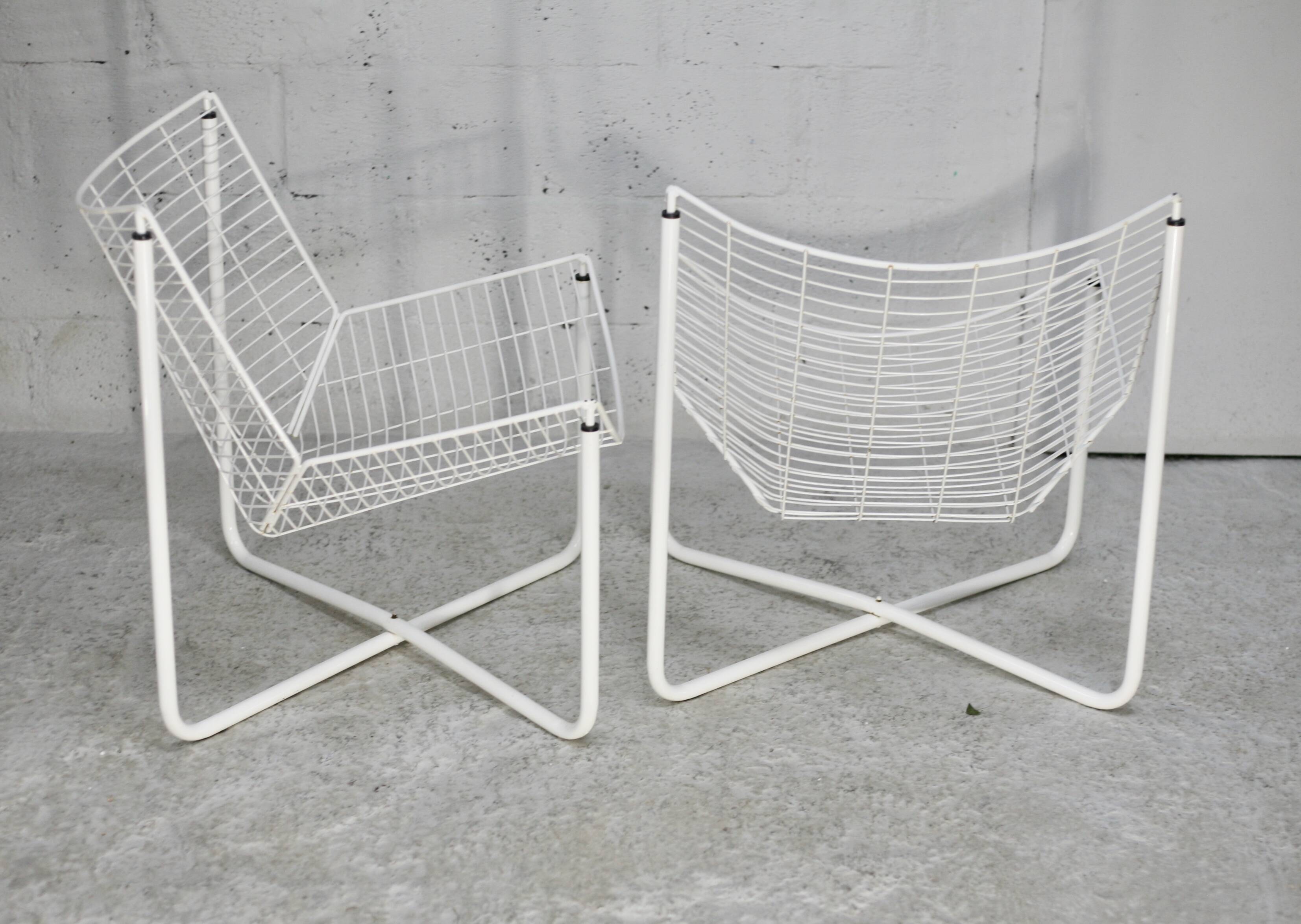 Pair of white lacquered steel rod armchairs. Circa 1985