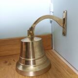 Wall entrance bell with bracket