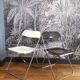 Duo of white and brown Piretti plia chairs
