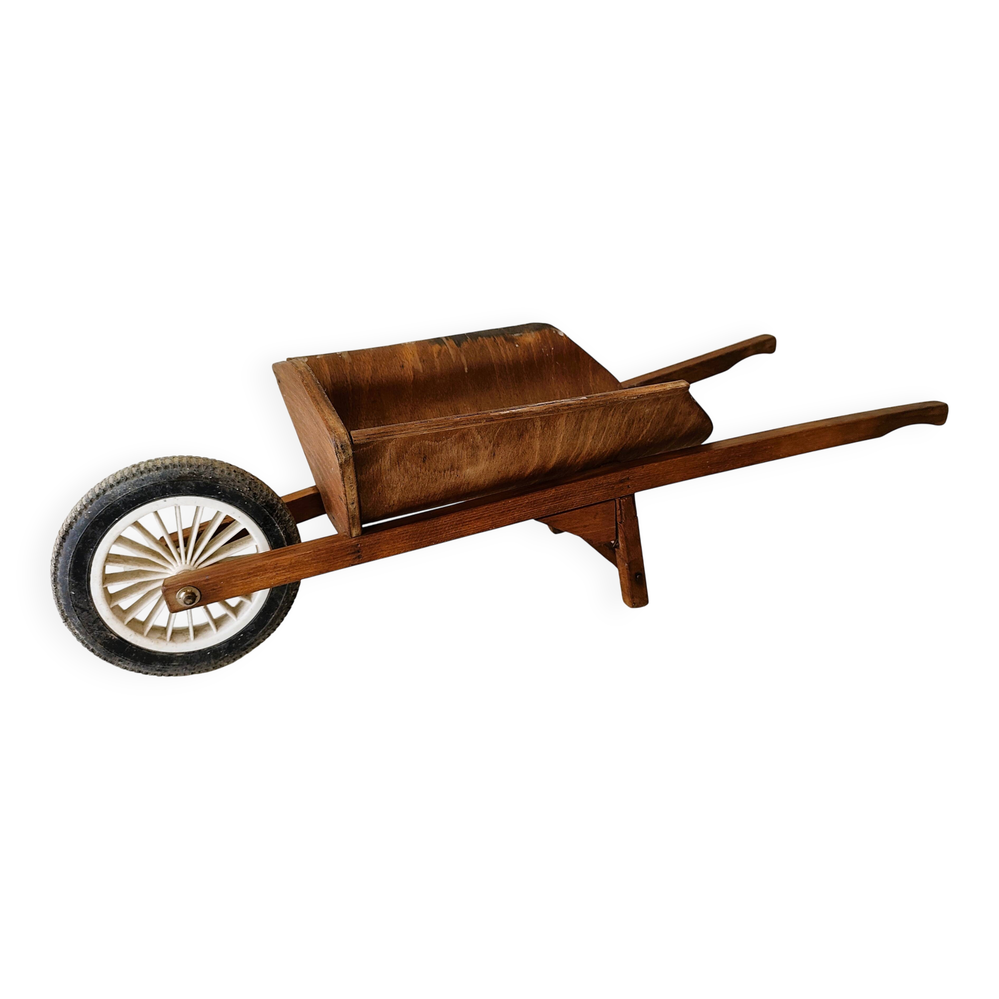 Old wooden toy wheelbarrow for children