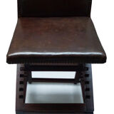 Old adjustable chair in wood and leather