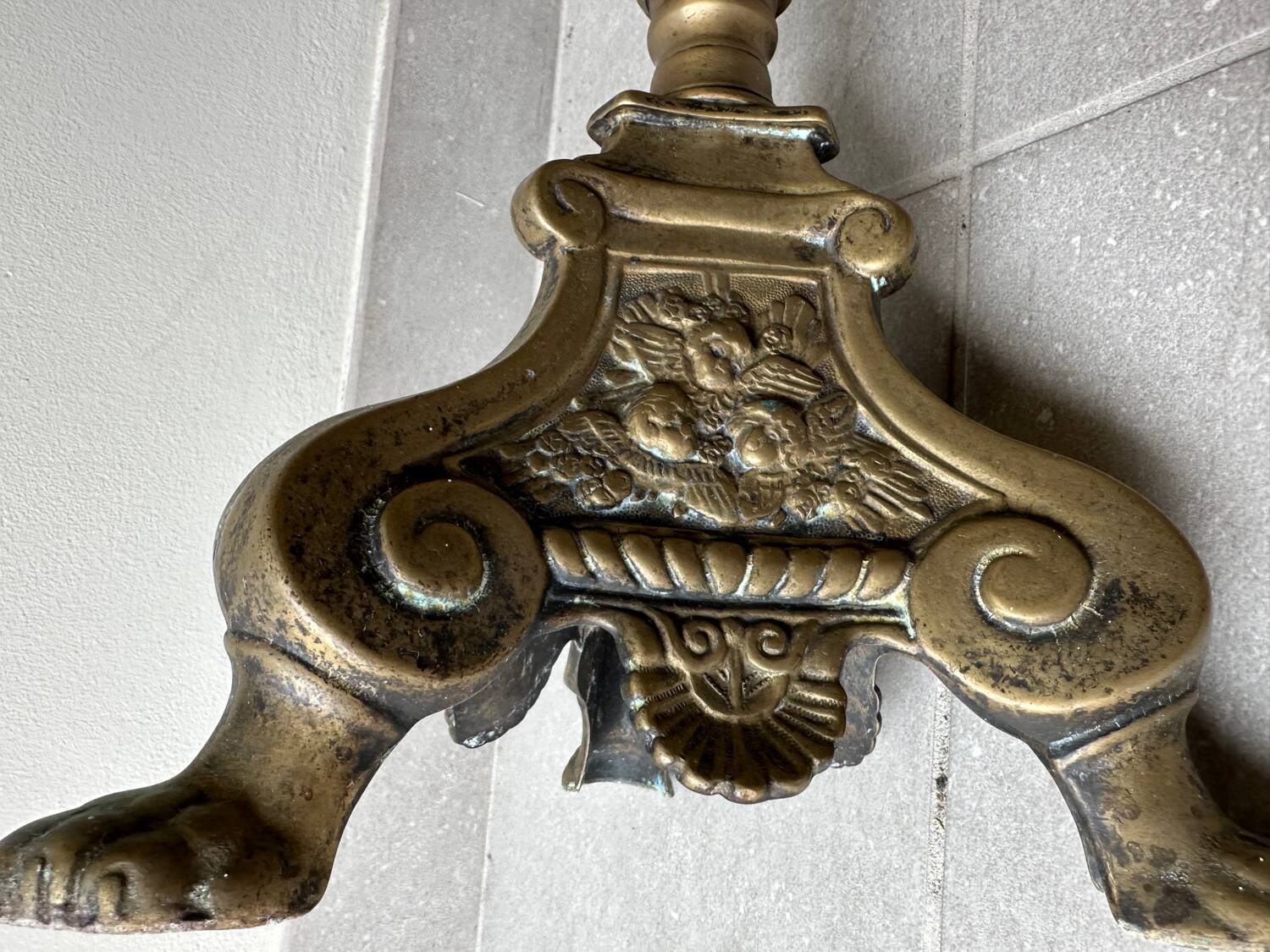 Gilded bronze candlestick with cherub trio decoration