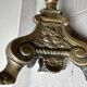 Gilded bronze candlestick with cherub trio decoration