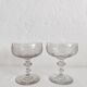 2 antique champagne glasses in engraved glass