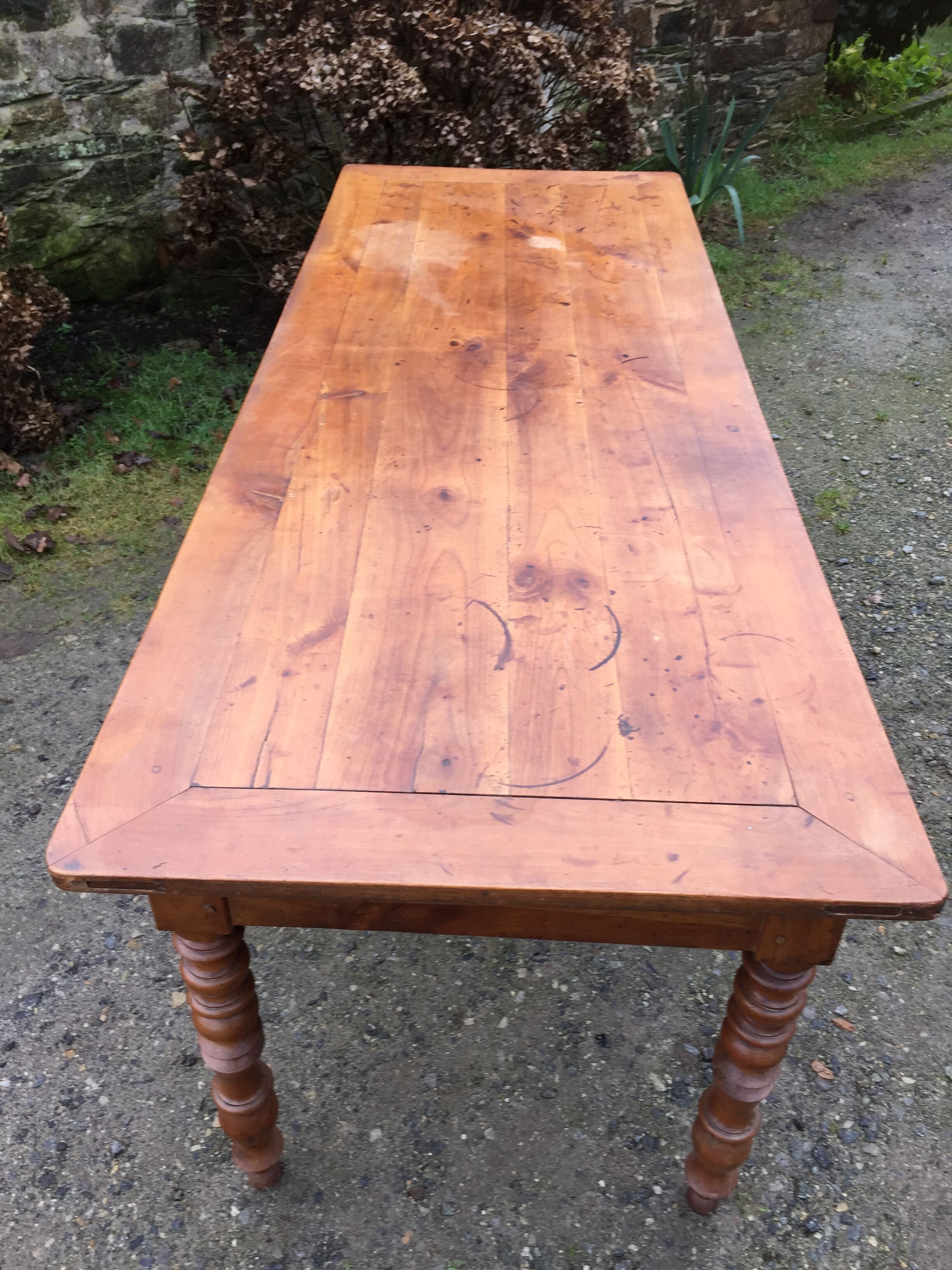 Old cherry farmhouse table with 3 drawers and turned legs
