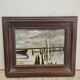 Landscape painting with a wooden frame