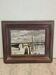 Landscape painting with a wooden frame