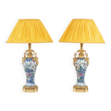 Pair of porcelain lamps decorated with bronze satyrs. Circa 1880.