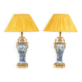 Pair of porcelain lamps decorated with bronze satyrs. Circa 1880.