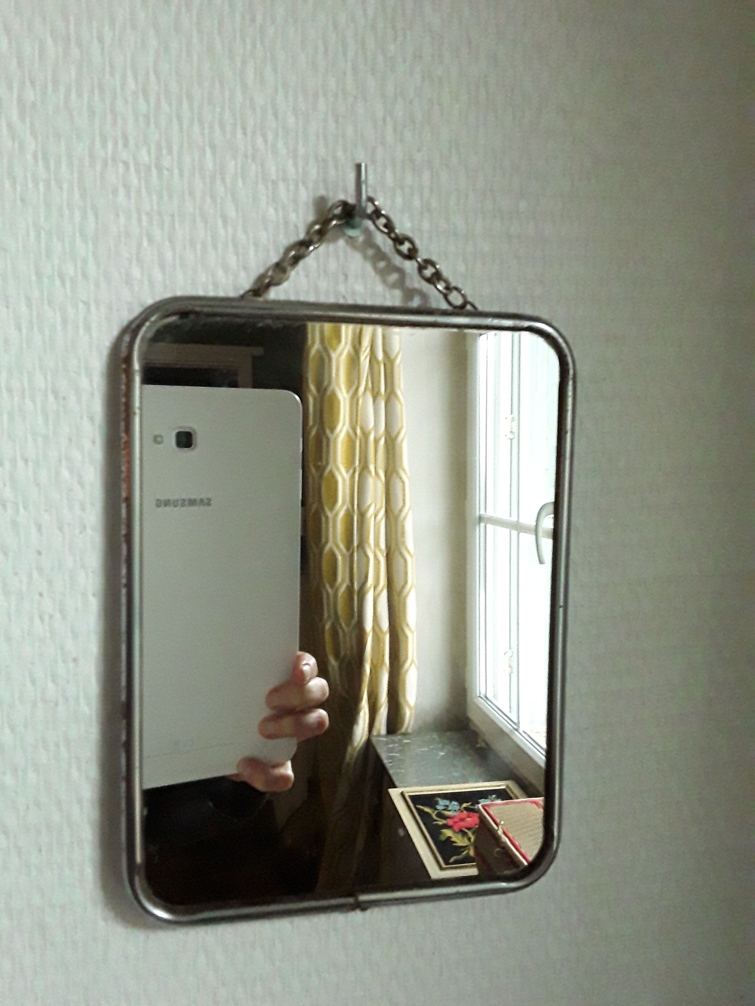 Vintage barber mirror with chain