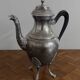 Empire style silver-plated verseuse, resting on three sculpted feet.