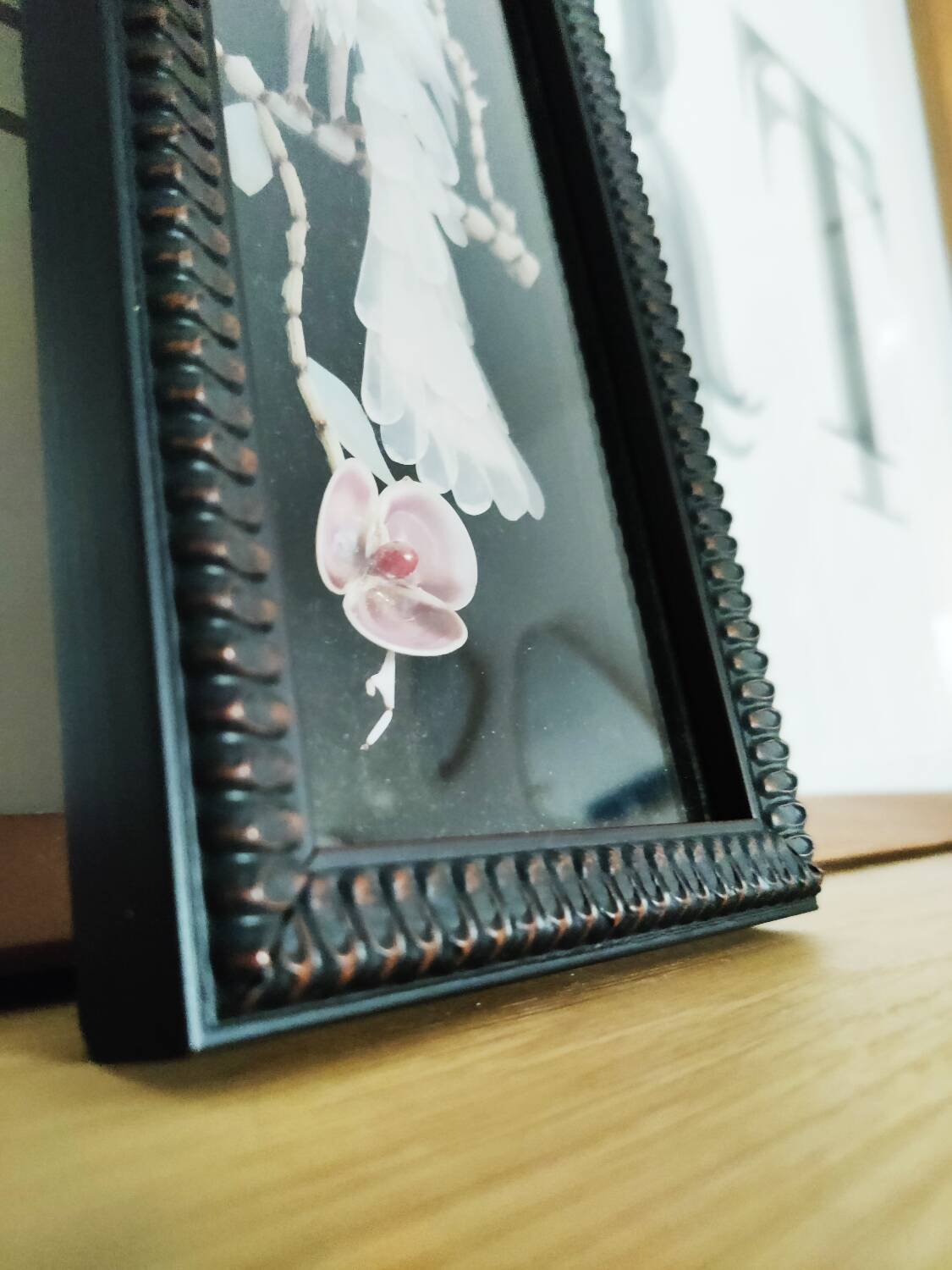 Mother-of-pearl bird still life