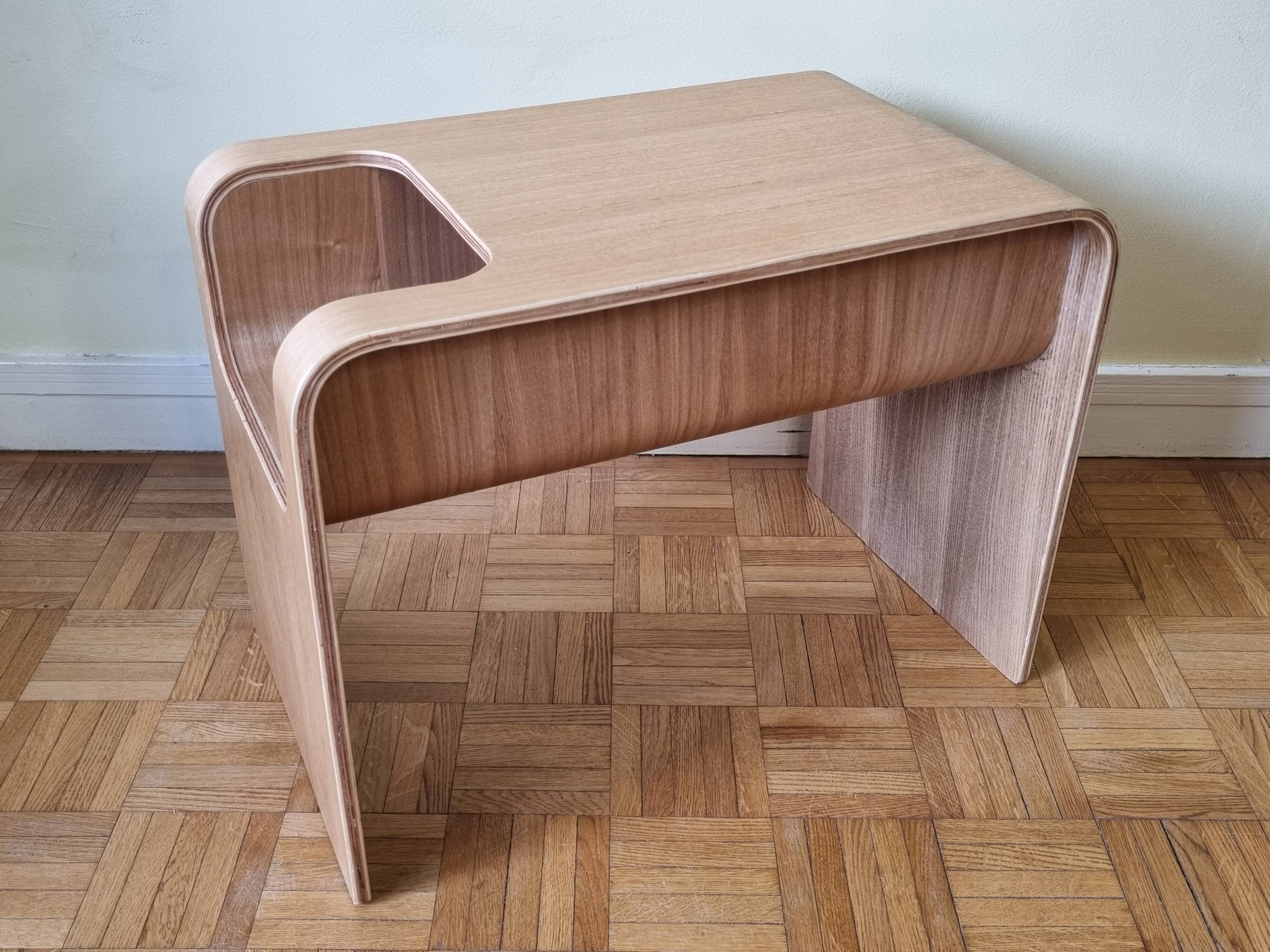Boone coffee table in curved wood produced by Habitat, design