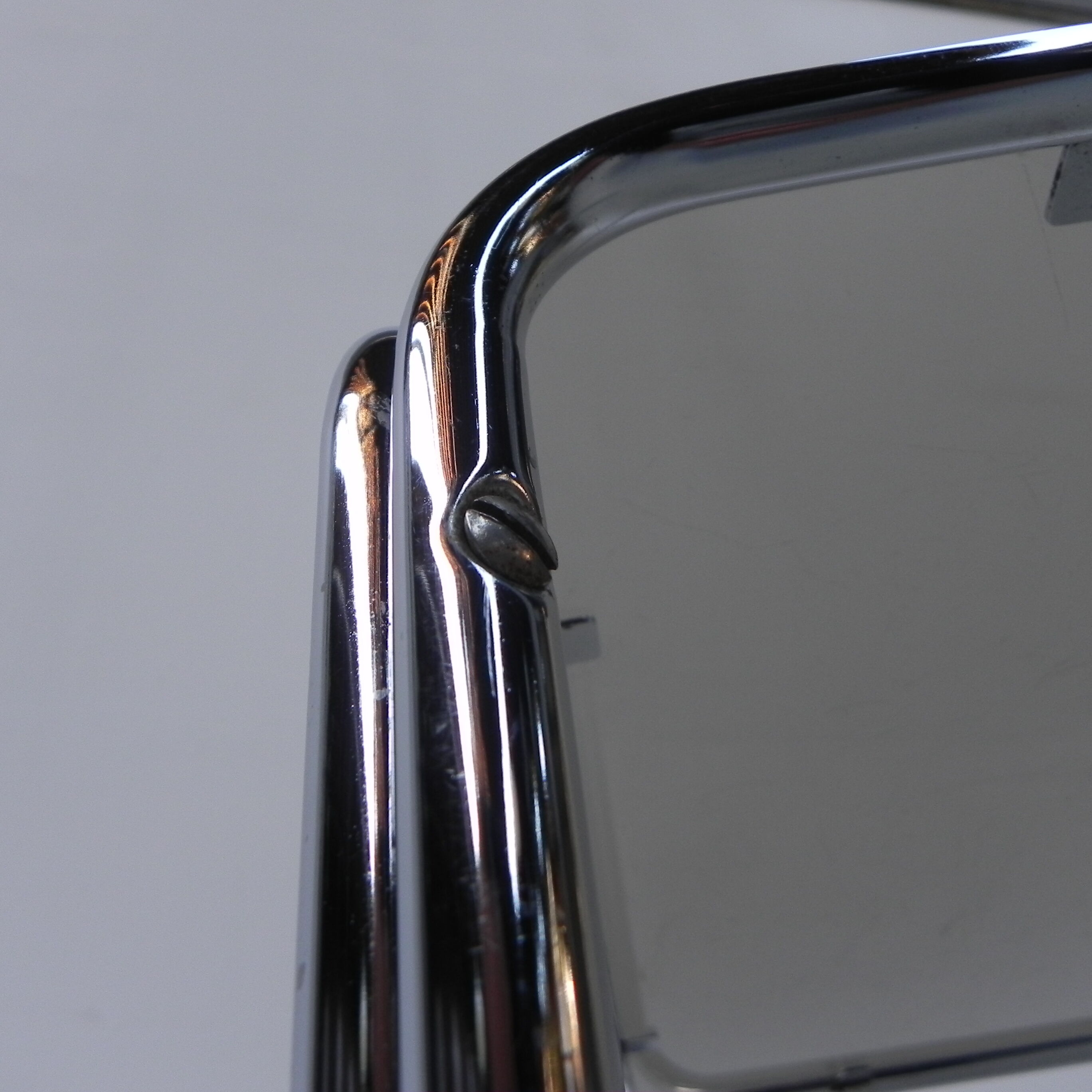 Coffee table with smoked glass top in chromed frame