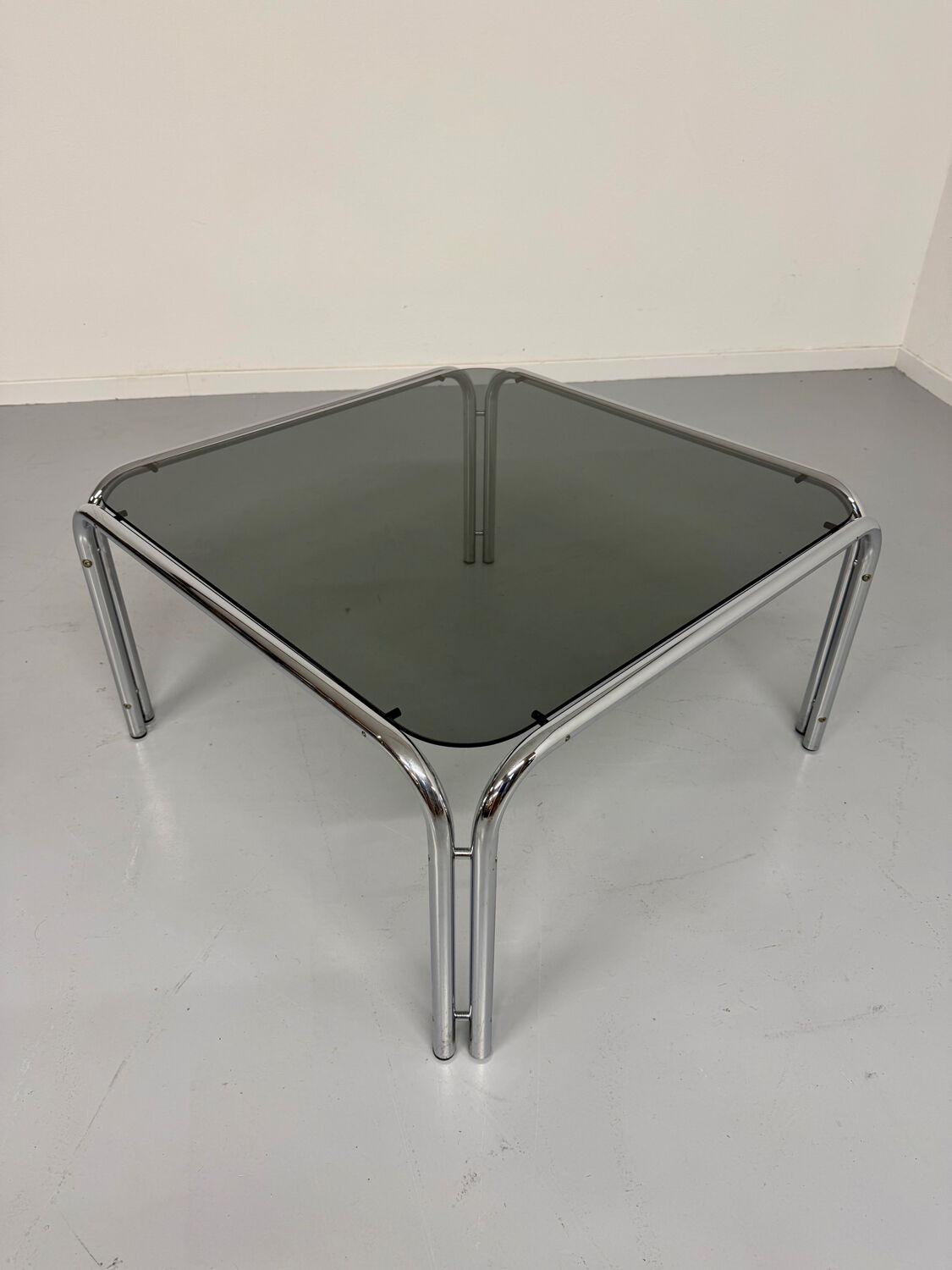 Space coffee table from the 70s, tubular metal and vintage smoked glass