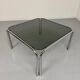 Space coffee table from the 70s, tubular metal and vintage smoked glass